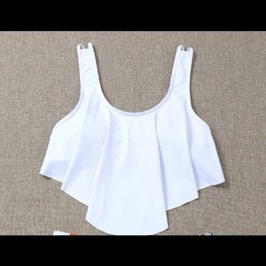 Flowy swim top, no wire, clip in back.